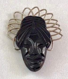 BP235 black bakelite face pin